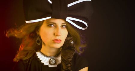 Portrait of vintage woman in classic hat. Retro styling girl. Retro portrait of a fashion elegance...