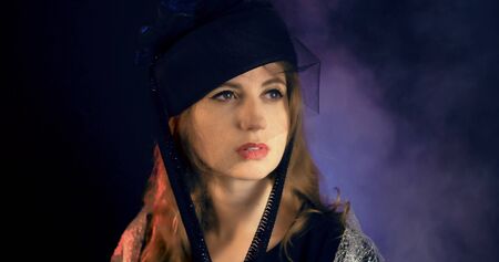 Portrait of vintage woman in classic hat. Retro styling girl. Retro portrait of a fashion elegance model. Vintage style.の写真素材