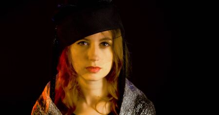Portrait of vintage woman in classic hat. Retro styling girl. Retro portrait of a fashion elegance...