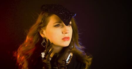 Portrait of vintage woman in classic hat. Retro styling girl Retro portrait of a fashion eleganse model. Vintage style.の写真素材