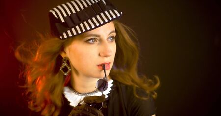 Portrait of vintage woman in classic hat. Retro styling girl Retro portrait of a fashion eleganse model. Vintage style.の写真素材