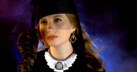 Portrait of vintage woman in classic hat. Retro styling girl. Retro portrait of a fashion elegance model. Vintage style.の写真素材