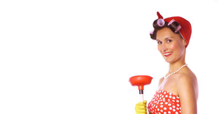Retro woman in a red dress and a yellow household gloves with a cleaning accessory. Isolated on white background. Housework or cleaning concept.の写真素材