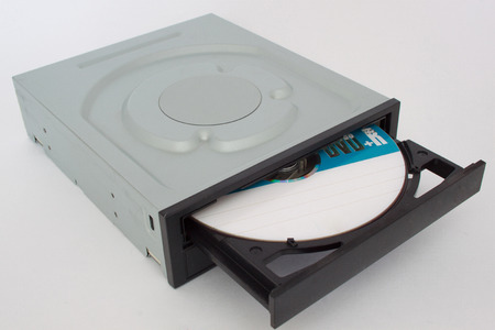 Opened CD - DVD drive with a black cap and disk inside.の写真素材