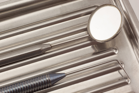 Dental instruments are lying in a medical tray. Healthy lifestyle.の写真素材