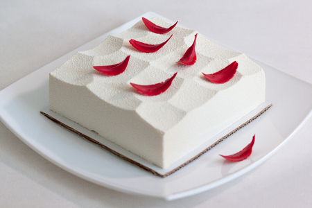 Mousse with tonquin bean, praline and raspberry. Sweet dishes.の写真素材