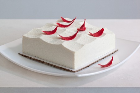 Mousse with tonquin bean, praline and raspberry. Sweet dishes.の写真素材