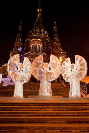 Russia, Izhevsk - January 29, 2017:Ice angels are standing in the square near the Svyato Mikhaylovsky sobor. Christmas holidays.のeditorial素材
