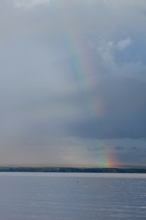 Beautiful rainbow appeared after the rain. Live earth.の写真素材