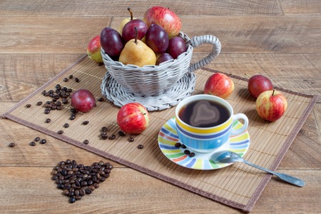 Autumn still life with various gifts of nature. Cup of coffee and cofee beans. Latte-art.の写真素材