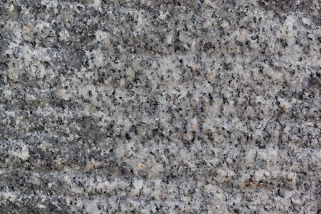 Marble or granite texture is used as a background. Abstract gray texture with many holes. Copy space...