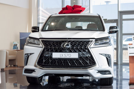 Russia, Izhevsk - April 21, 2018: Showroom Lexus. New vehicle Lexus LX570 in dealer showroom. Famous world brand. Front view.のeditorial素材