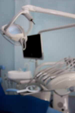 Dental treatment unit and other service equipment with blur effect. Themed blur background with bokeh effect.の写真素材