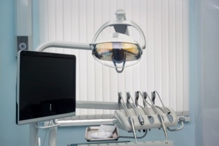 Dentist office. Dental treatment unit and equipment with blur background. Healthy lifestyle.の写真素材