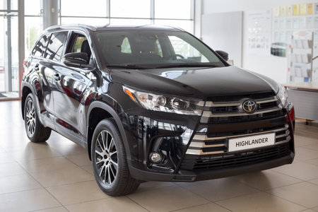 Russia, Izhevsk - July 18, 2019: New cars in the Toyota showroom. Modern Highlander. Famous world brand. Prestigious cars.のeditorial素材
