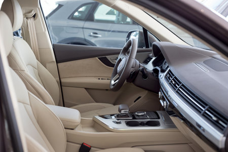 Russia, Izhevsk - September 11, 2019: Audi showroom. Interior of new Q7 Quattro with automatic transmission in dealer showroom. Famous world brand. Modern transportation.のeditorial素材