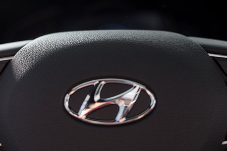 Russia, Izhevsk - October 30, 2019: Hyundai showroom. Logo of Hyundai car on the steering wheel. Modern transportation. Famous world brand.のeditorial素材