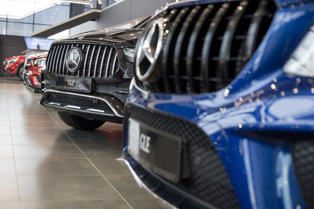Russia, Izhevsk - February 20, 2020: Mercedes-Benz showroom. New cars in the dealer showroom. Famous world brand. Prestigious vehicles.のeditorial素材