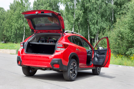 Russia, Izhevsk - August 13, 2020: New modern Subaru XV car with open car boot and open door. Famous world brand. Prestigious vehicles.のeditorial素材