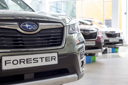 Russia, Izhevsk - August 13, 2020: Subaru Forester and other new modern cars in the Subaru showroom. Famous world brand. Prestigious vehicles.のeditorial素材