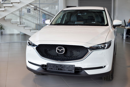 Russia, Izhevsk - August 06, 2020: New modern crossover CX-5 in the Mazda showroom. Front view. Famous world brand.のeditorial素材