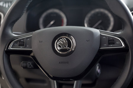 Russia, Izhevsk - September 25, 2020: Skoda showroom. Steering wheel and dashboard of new Karoq car. Famous world brand. Prestigious vehicles.のeditorial素材