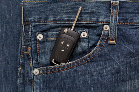 Switch key is lying in side pocket of blue jeans. Modern lifestyle.の写真素材