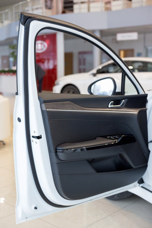 Russia, Izhevsk - December 28, 2020: KIA showroom. Details of car door new K5. Famous world brand....