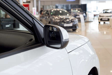 New modern unknown cars at dealer showroom. Themed blur background with blur effect. Car auto...