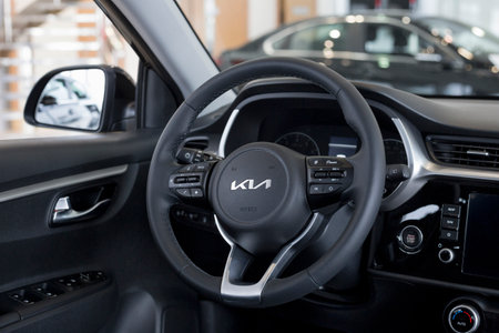 Russia, Izhevsk - February 17, 2022: KIA showroom. Interior of new modern Rio X car in dealer showroom. famous world brand. modern transportation.のeditorial素材
