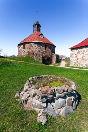 Old well in fortress on a green grass  Korela の写真素材