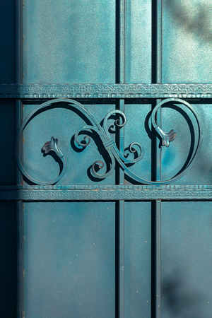 the forged curl, pattern from metal of blue-green color.の写真素材