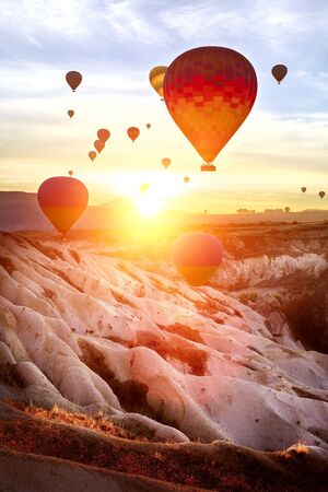 Color balloon at sunrise. Landscape. The Valley Of Love. The sun's rays hit the camera lens.の写真素材