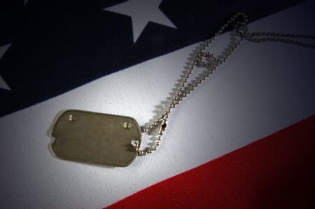 Dog tag on American Flag.Freedom is not free の写真素材