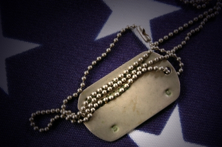 Dog tag on American Flag.Freedom is not free の写真素材