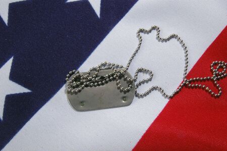 Dog tag on American Flag.Freedom is not free の写真素材