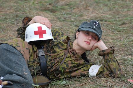 KIEV, UKRAINE - MAY 10,2010 : member of Red Star history club wears historical military German paramedic uniform during historical reenactment of 1945 WWII, May 10, 2010 in Kiev, Ukraine のeditorial素材