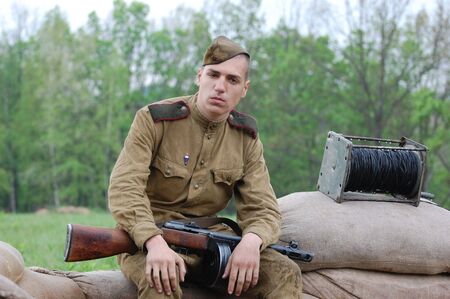 KIEV, UKRAINE - MAY 10 : A member of Red Star history club wears historical Soviet uniform during historical reenactment of 1945 WWII, May 10, 2010 in Kiev, Ukraine のeditorial素材