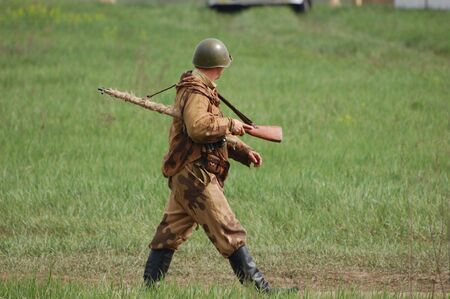 KIEV, UKRAINE - MAY 10 : A member of Red Star history club wears historical Soviet uniform during historical reenactment of 1945 WWII, May 10, 2010 in Kiev, Ukraine のeditorial素材