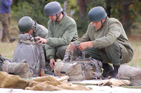 CHERNIGOW, UKRAINE - AUG 29: Members of Red Star military history club wear historical German paratrooper uniform during historical reenactment of WWII, August 29, 2010 in Chernigow, Ukraine のeditorial素材