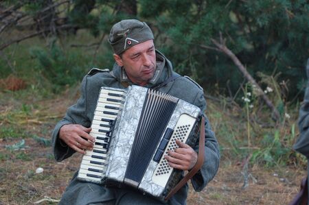 CHERNIGOW, UKRAINE - AUG 29: A member of Red Star military history club wears historical German...