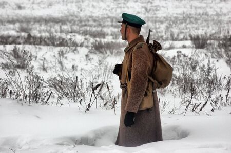 KIEV, UKRAINE - FEB 14: Members of a history club wears historical Soviet uniforms in action during a WWII reenactment of 'Defense Kiev in 1943' on February 14, 2010 in Kiev, Ukraine. のeditorial素材