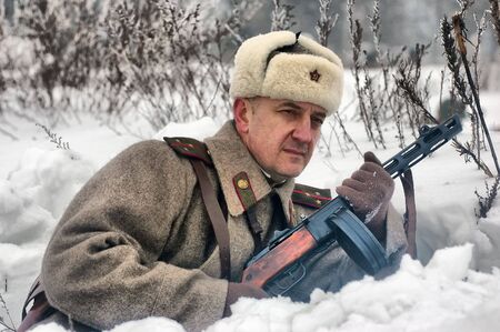 KIEV, UKRAINE - FEB 14: Members of a history club wears historical Soviet uniforms in action during a WWII reenactment of 'Defense Kiev in 1943' on February 14, 2010 in Kiev, Ukraine. のeditorial素材