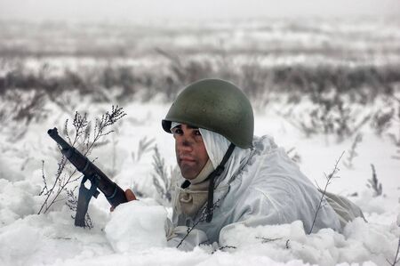KIEV, UKRAINE - FEB 14: Members of a history club wears historical Soviet uniforms in action during a WWII reenactment of 'Defense Kiev in 1943' on February 14, 2010 in Kiev, Ukraine. のeditorial素材