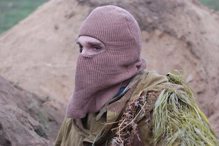 KIEV, UKRAINE - DEC 6: Member of a history club Red Star wears historical Soviet uniforms during a WWII reenactment 'Defense Kiev' in 1943 on December 6, 2009 in Kiev, Ukraine のeditorial素材