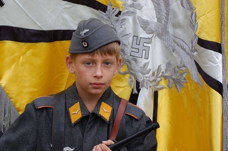 CHERNIGOW, UKRAINE - AUG 29: Member of Red Star military history club wears historical German uniform during historical reenactment of WWII, August 29, 2010 in Chernigow, Ukraine のeditorial素材