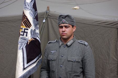 CHERNIGOW, UKRAINE - AUG 29: Member of Red Star military history club wears historical German...