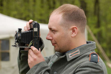 KIEV, UKRAINE - MAY 9: A member of a military history club wears a historical German uniform as he participates in a WWII reenactment May 9, 2008 in Kiev, Ukraineのeditorial素材