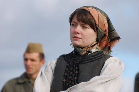 KIEV, UKRAINE - NOV 7: member of Red Star history club wears historical Ukrainian costume during historical reenactment of Kiev Liberation in 1943, November 7, 2010 in Kiev, Ukraine のeditorial素材