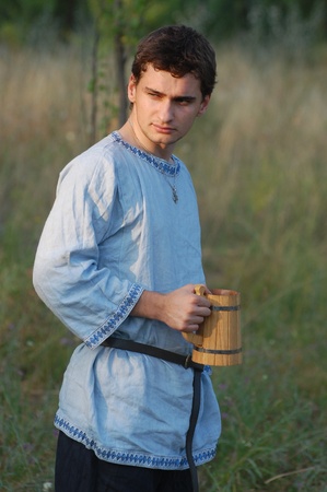 KIEV, UKRAINE - JULY 31: Member of history club Golden Capricorn wears medieval costume as he participates in historical festival and camp in memory King Vladimir July 31, 2009 in Kiev, Ukraineのeditorial素材